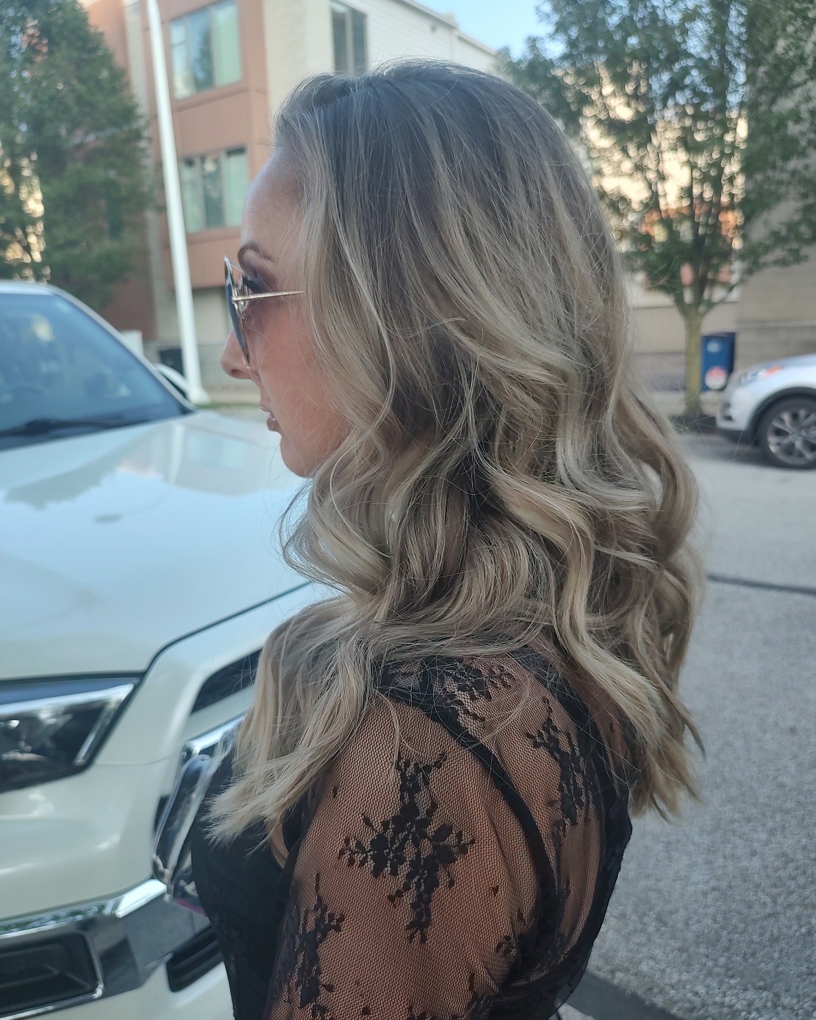 Long wavy blonde balayage, leaving the salon